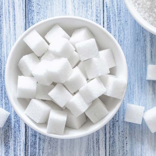 Weight loss starts with a reduction in sugar. Picture shows a bowl of cubes of sugar